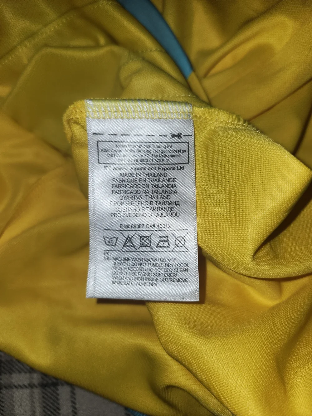 adidas Yellow Soccer Jersey with Blue and Black Stripes and Opel Logo